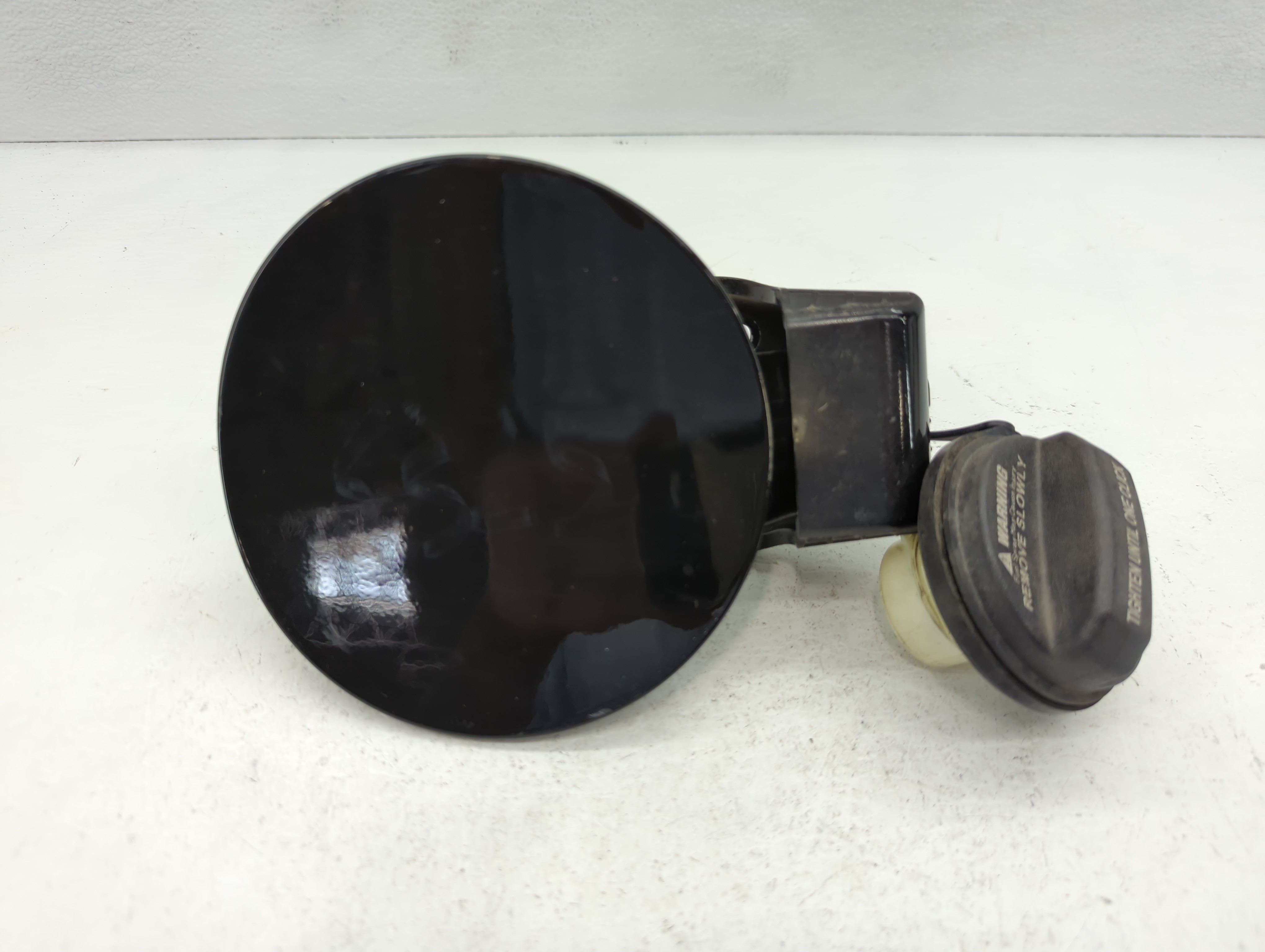 2013 Hyundai Elantra Fuel Tank Door Lid Gas Tank Black 1037417 - Oemusedautoparts1.com