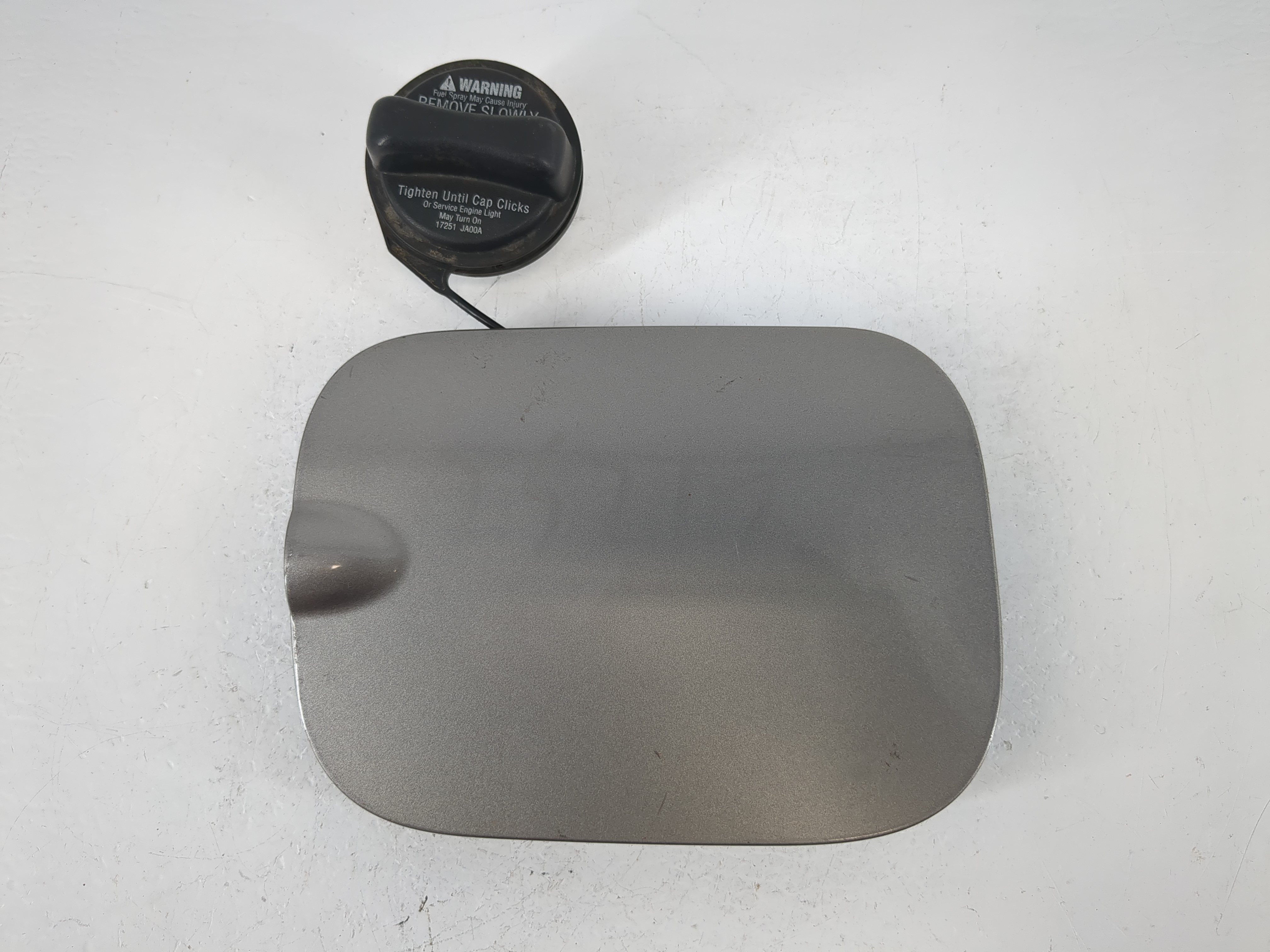 Picture of 2008 Nissan Rogue Fuel Tank Door Lid Gas Tank Grey 1064806