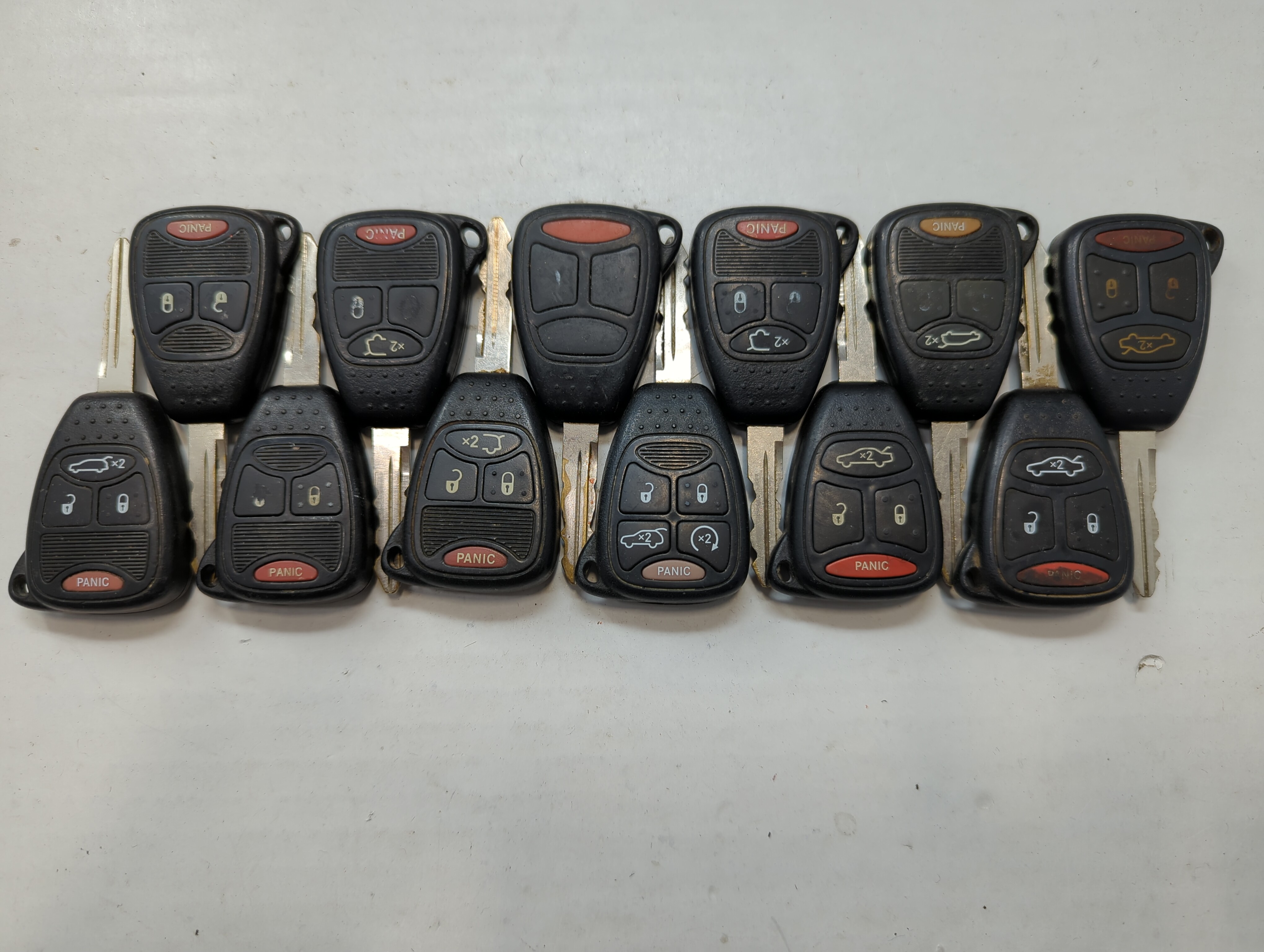 Lot of 12 Jeep Keyless Entry Remote Fob MIXED FCC IDS MIXED PART NUMBERS 722214 - Oemusedautoparts1.com