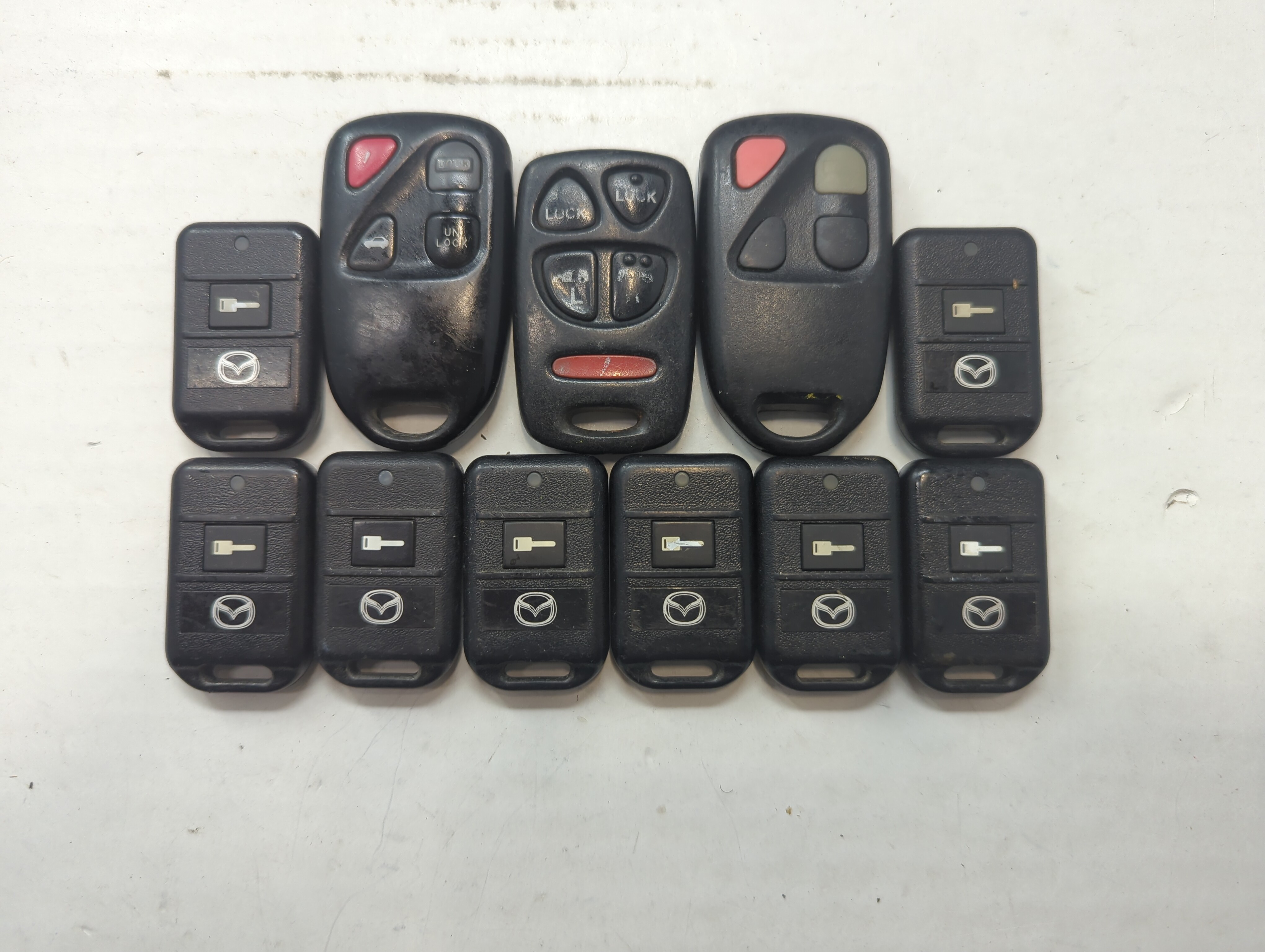 Lot of 11 Mazda Keyless Entry Remote Fob PCMINI | OUCG8D-333A-A | 758811 - Oemusedautoparts1.com