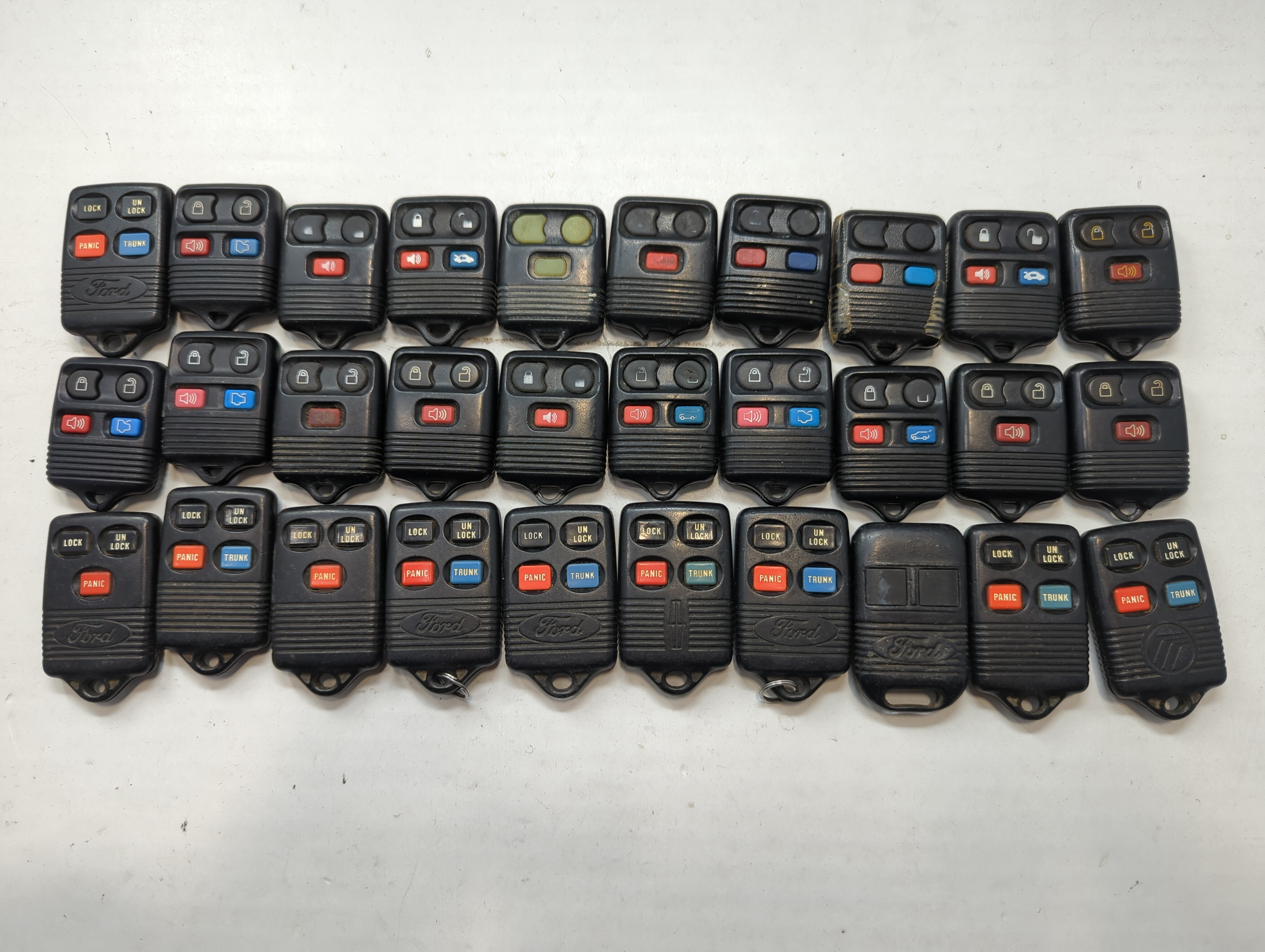 Lot of 30 Ford Keyless Entry Remote Fob MIXED FCC IDS MIXED PART NUMBERS 776584 - Oemusedautoparts1.com