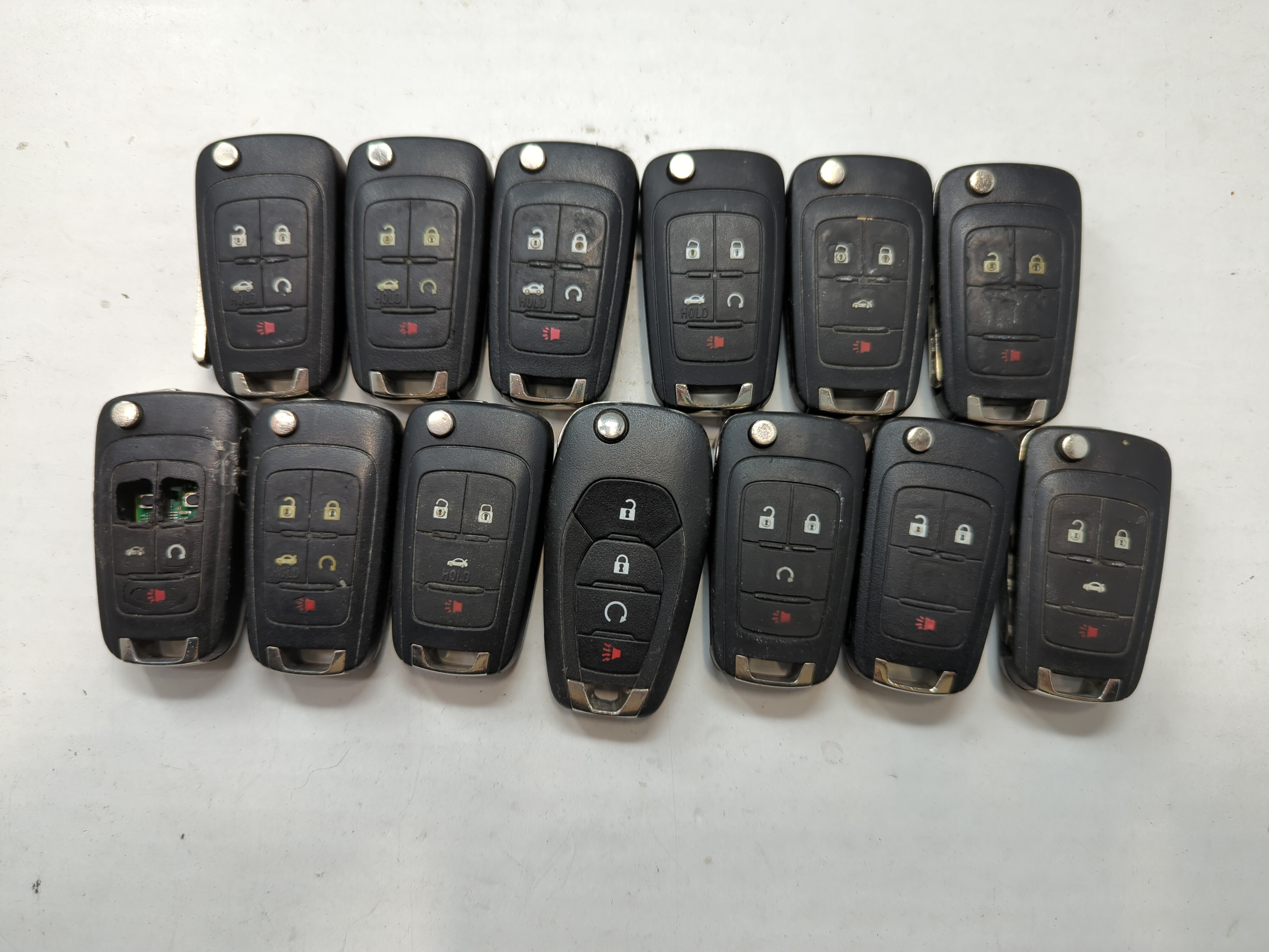 Lot of 13 Chevrolet Keyless Entry Remote Fob MIXED FCC IDS MIXED PART 776589 - Oemusedautoparts1.com