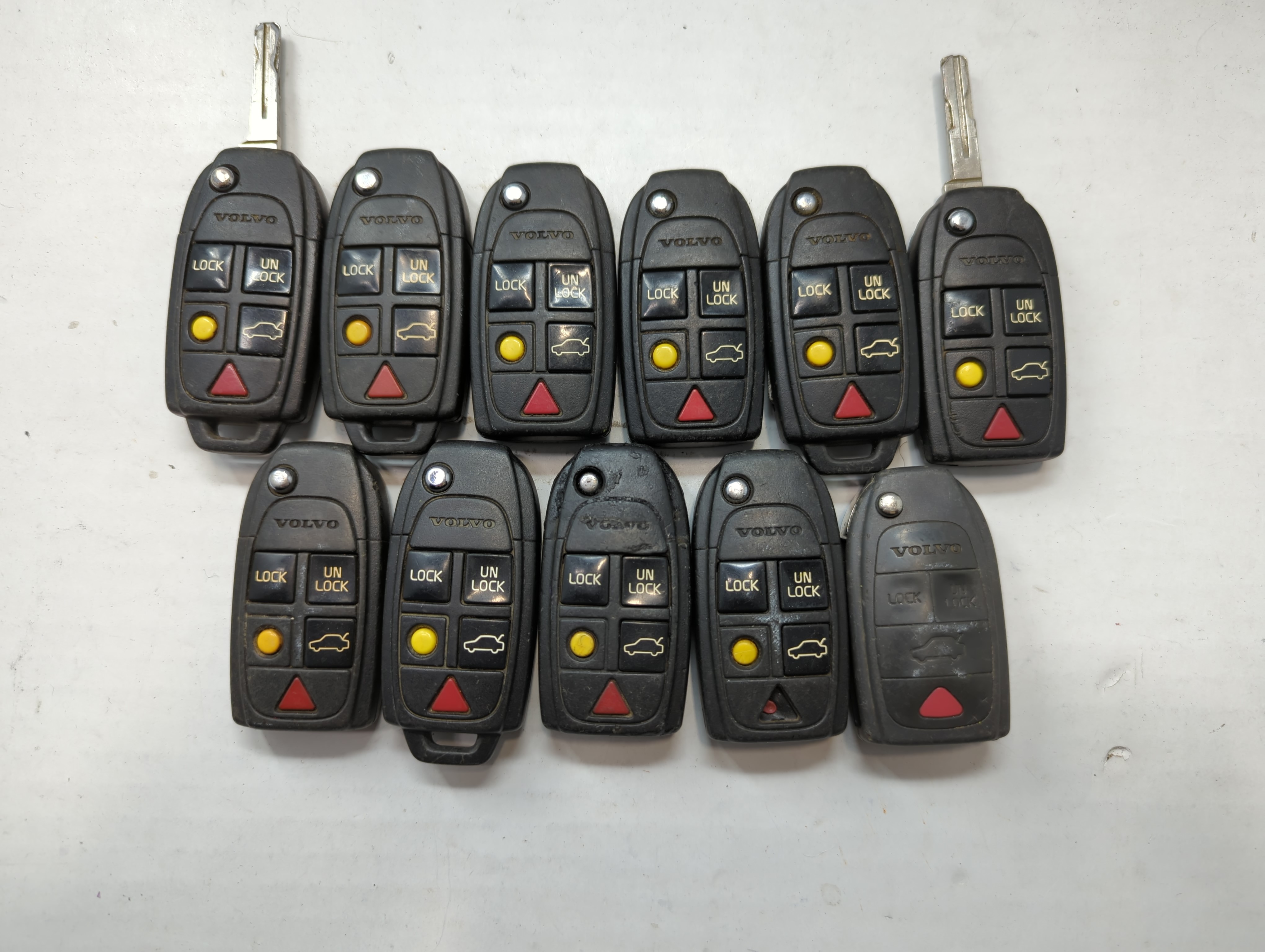 Lot of 11 Volvo Keyless Entry Remote Fob MIXED FCC IDS MIXED PART NUMBERS 776656 - Oemusedautoparts1.com