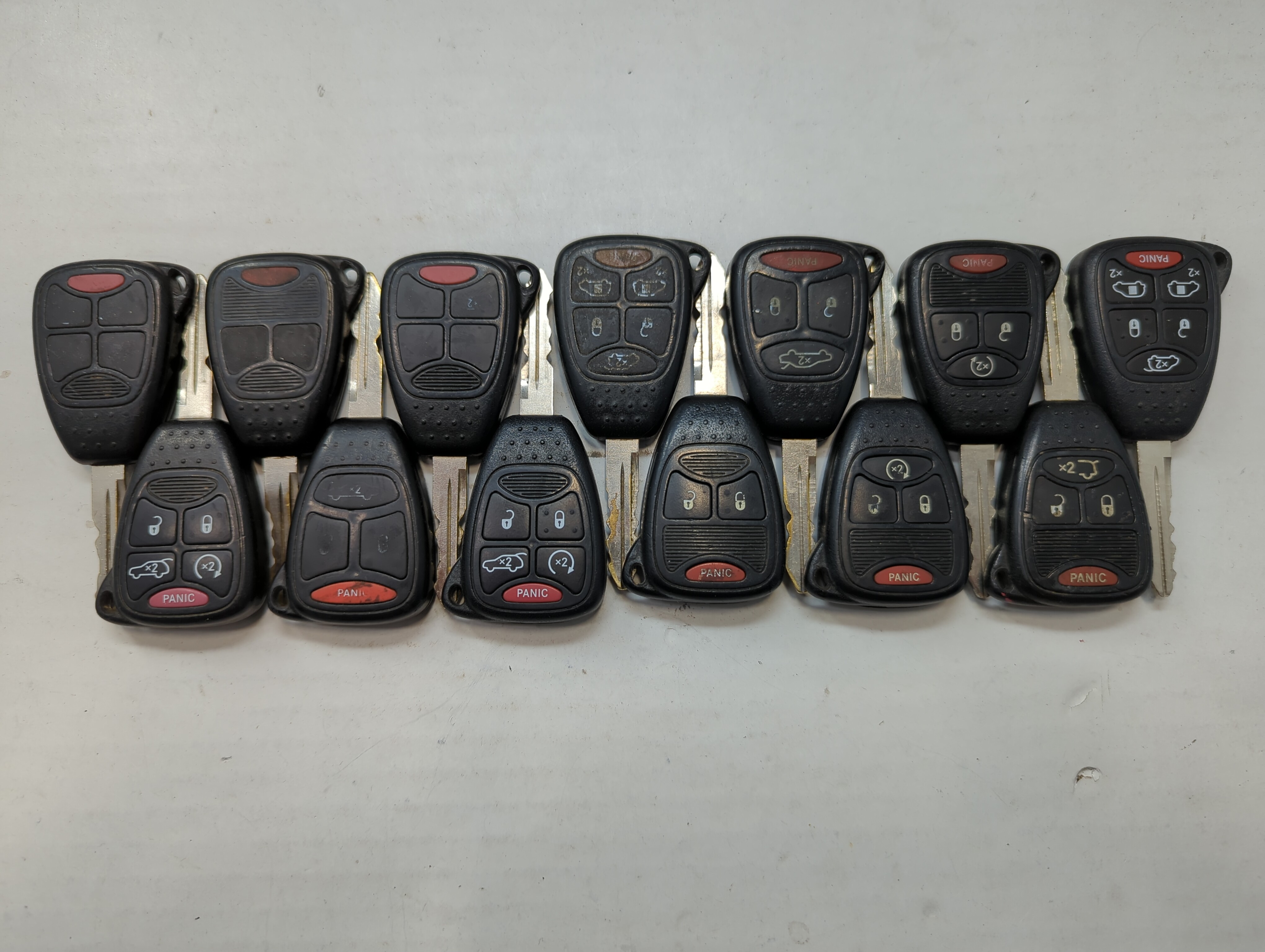 Lot of 15 Dodge Keyless Entry Remote Fob MIXED FCC IDS MIXED PART NUMBERS 776706 - Oemusedautoparts1.com