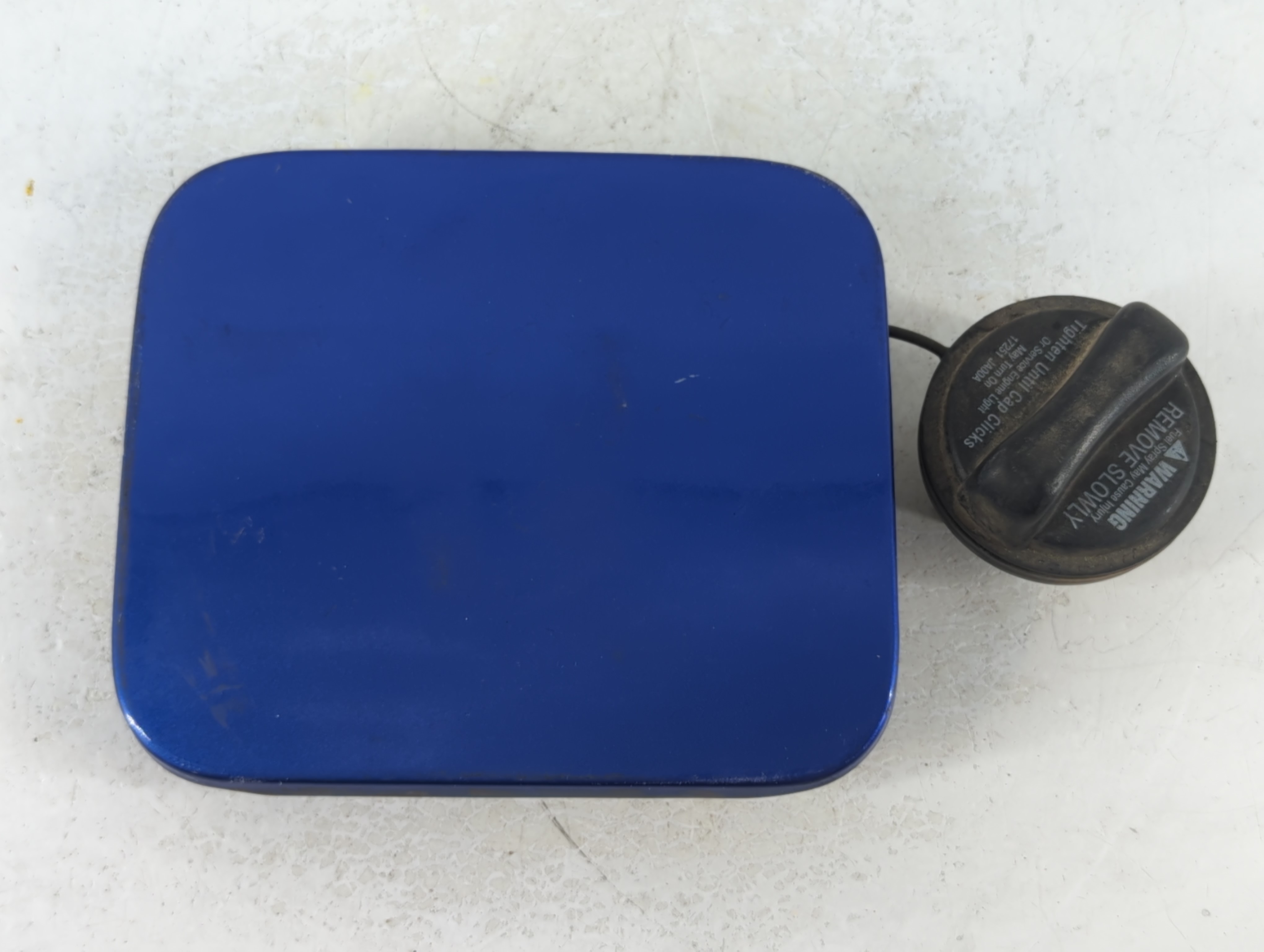 Picture of 2010 Nissan Versa Fuel Tank Door Lid Gas Tank 923042